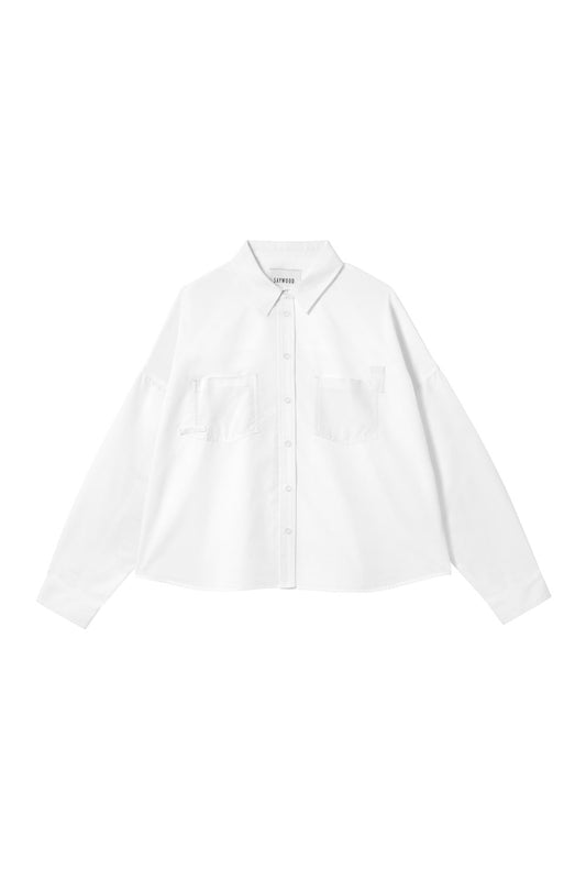 Women's white recycled cotton boxy shirt - The Lela Shirt, with patch pockets and cotton herringbone tape detail on the pocket corners. Made in the UK. By Saywood