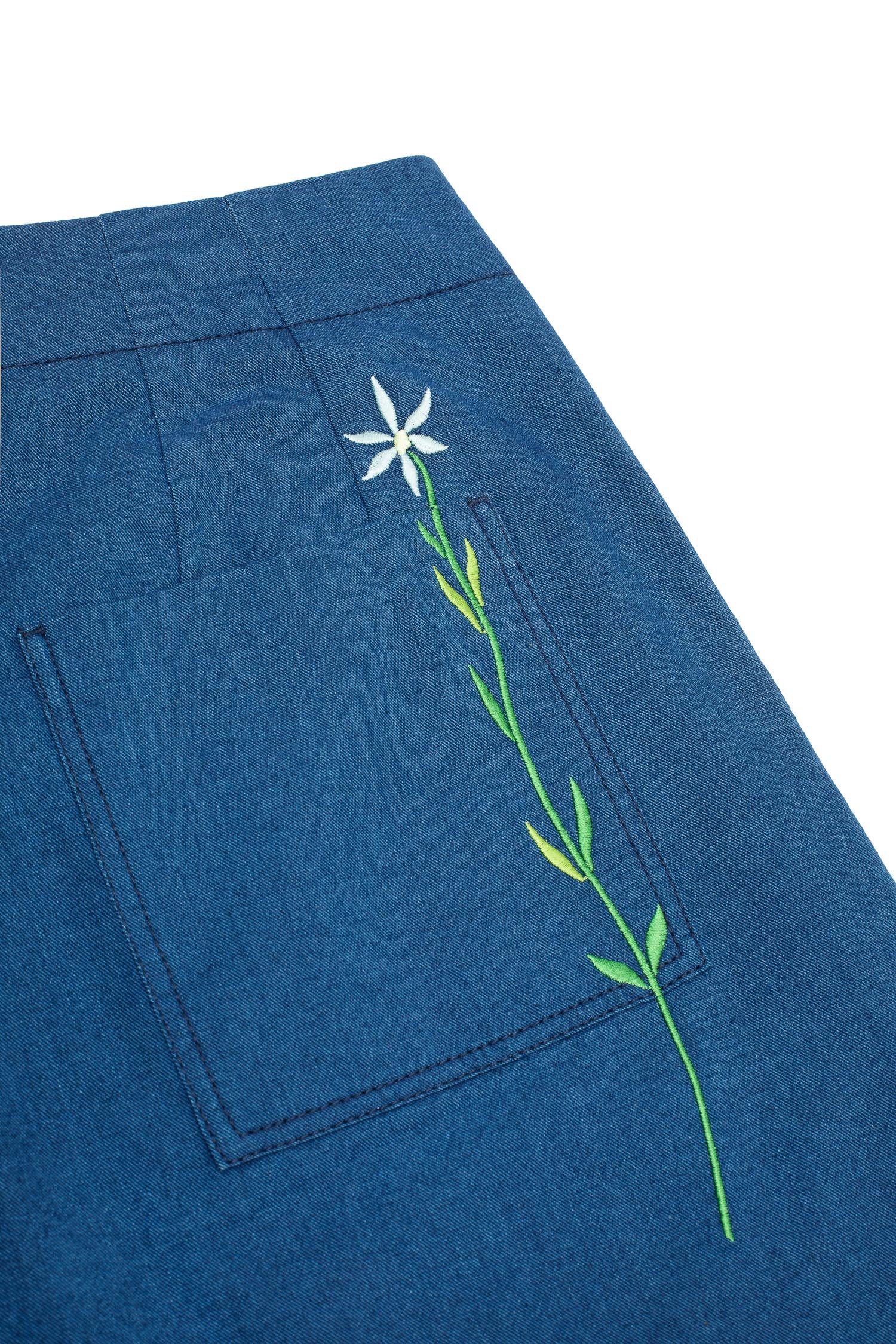 Womens wide leg culotte trouser in Japanese Denim. Amelia Wide Leg Trouser by Saywood. Natural indigo, cotton. Back close up of patch pocket and blue embroidered flower