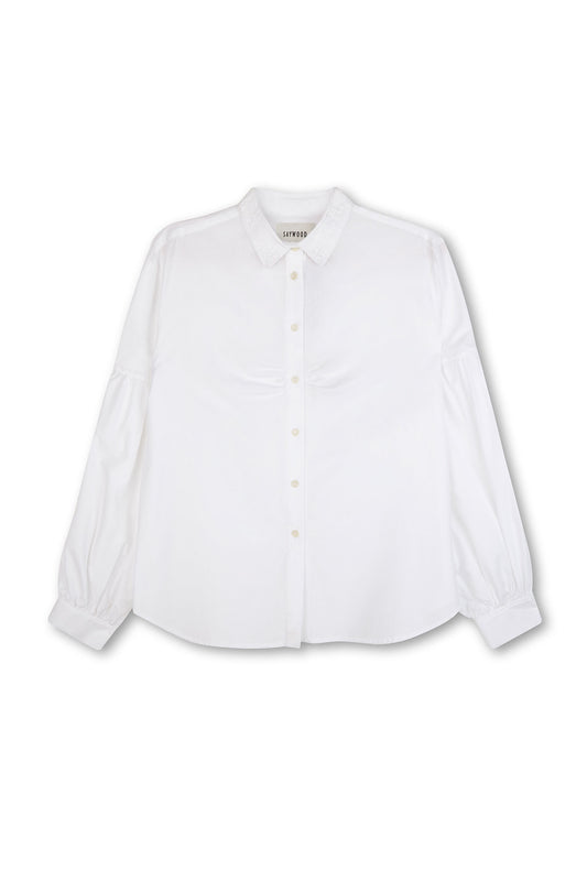 Womens white shirt with lace collar and volume sleeves, with soft gathering at the bust. Shirt is on a white background