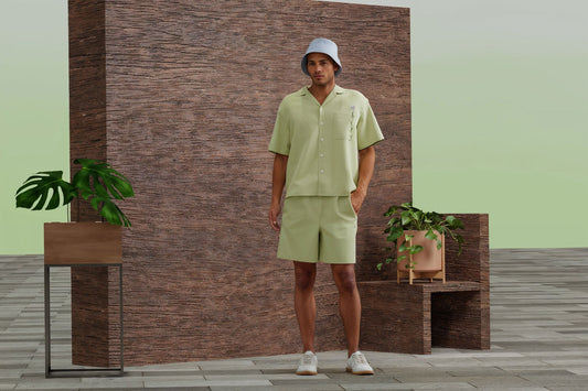 Digital male avatar wearing a green cuban shirt or bowling shirt with a green background and wooden wall