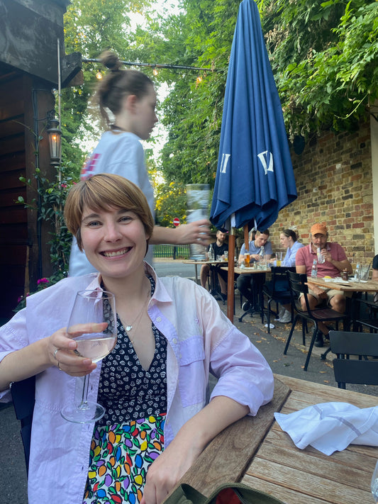 Founder Harriet wearing her pink lilac Jules Shirt in the pub