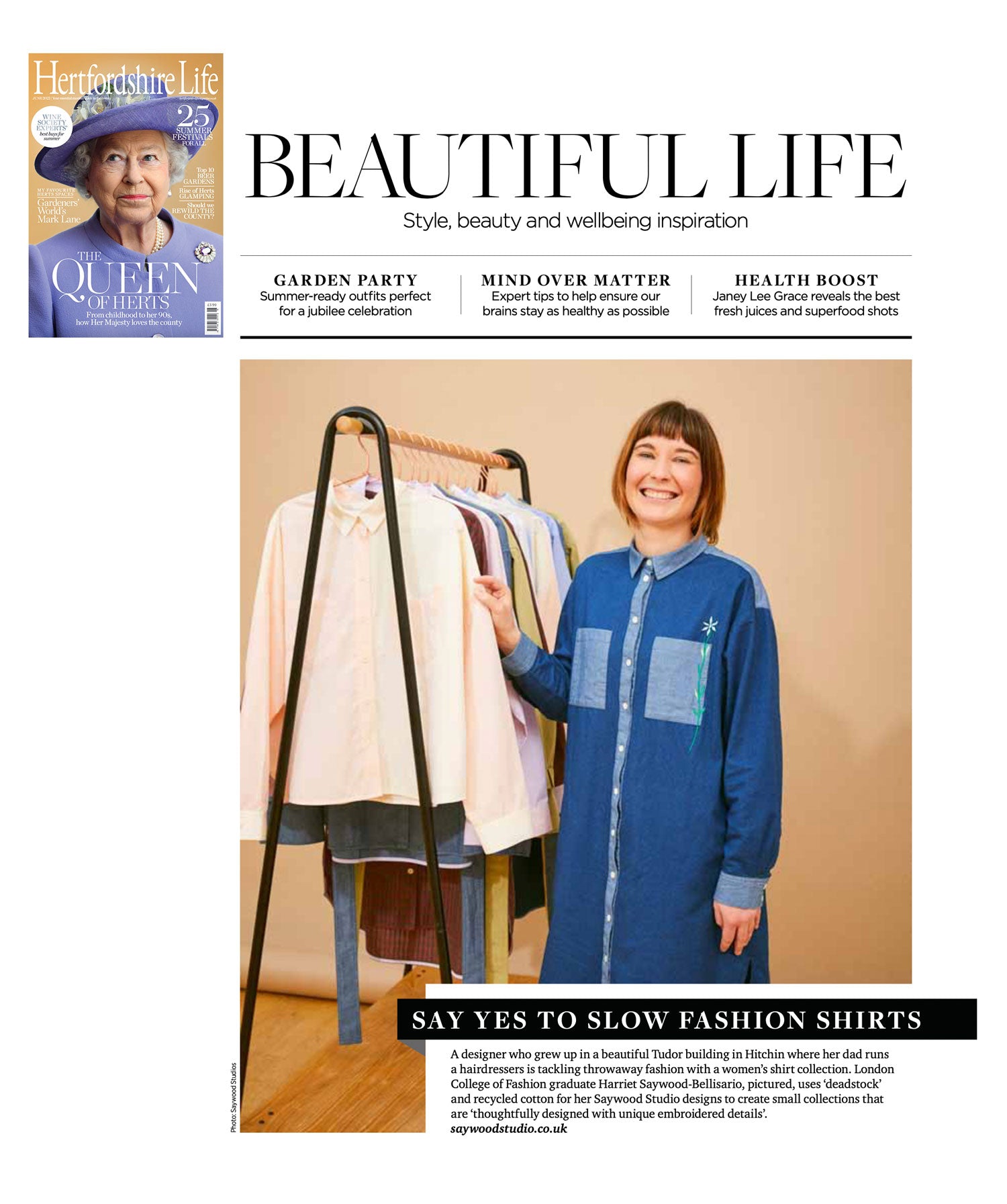 Image shows page from Hertfordshire Life with the title 'Beautiful Life' and 'Say yes to slow fashion shirts', showing a picture of Saywood founder Harriet, wearing the Etta Shirtdress in Japanese denim, standing next to a rail of her shirts. 