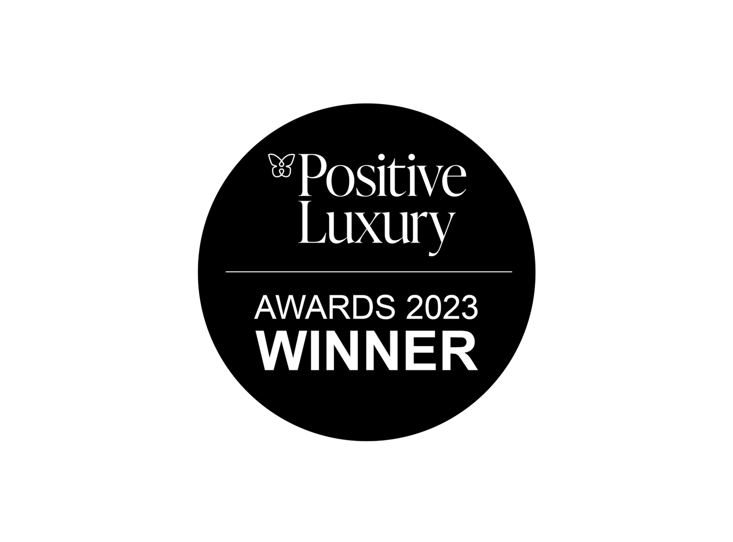 Black roundel with the text 'Positive Luxury Awards Winner 2023' - Saywood announced as winner of Positive Luxury's Breakthrough Business of the Year Award 2023