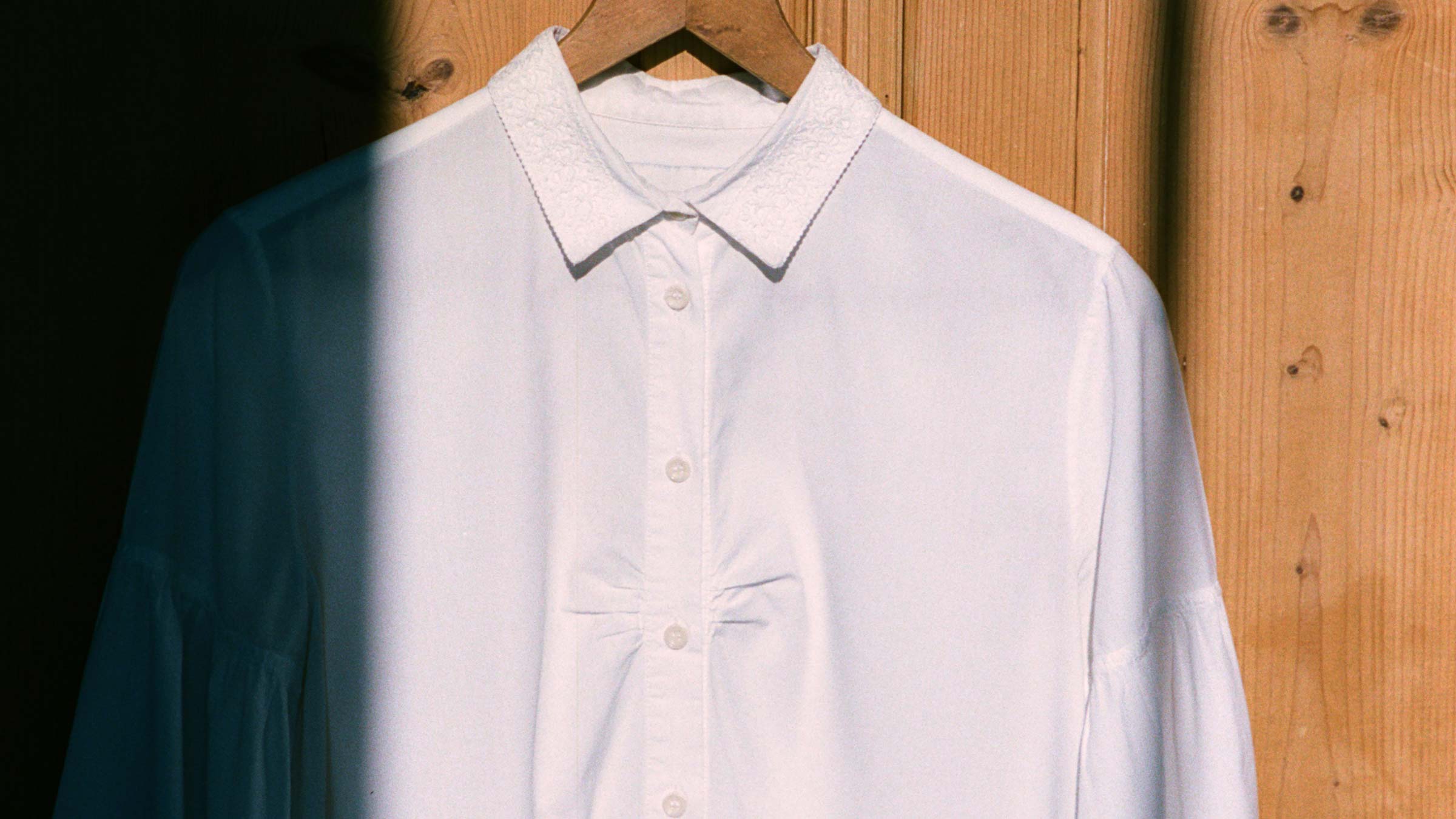 White lace collar Edi Shirt on a hanger, made in London by Saywood