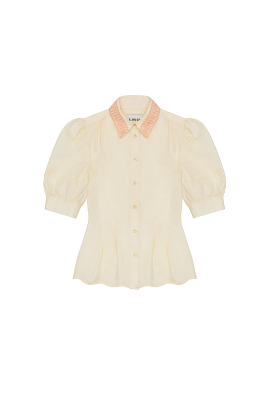 Womens pale yellow lace collar blouse with puff sleeves. Joni Blouse with soft orange lace trim collar, scalloped hem and soft darts at waist for a fit and flare shape, made in the UK. By Saywood.