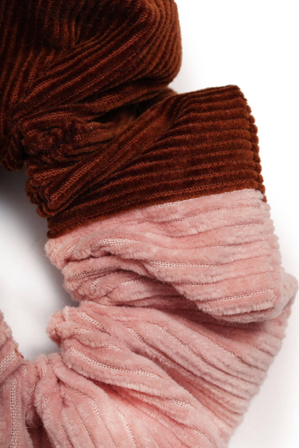 Patchwork scrunchie in pink and caramel tan cotton corduroy, by Saywood. Made in London. Detail short of the corduroy fabric.