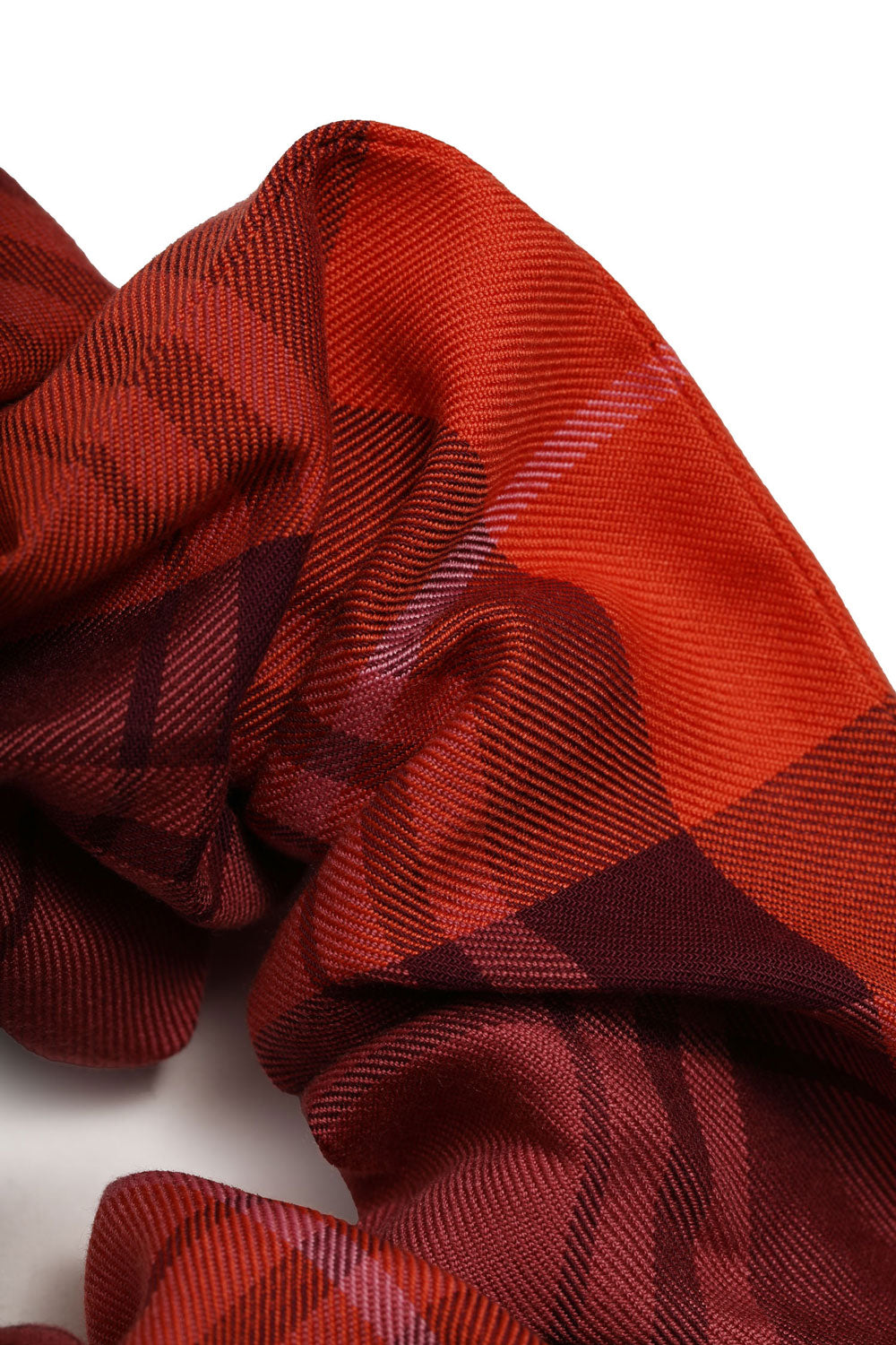 Tartan scrunchie in merlot coral red colour by Saywood. Made in London. Detail shot of fabric.