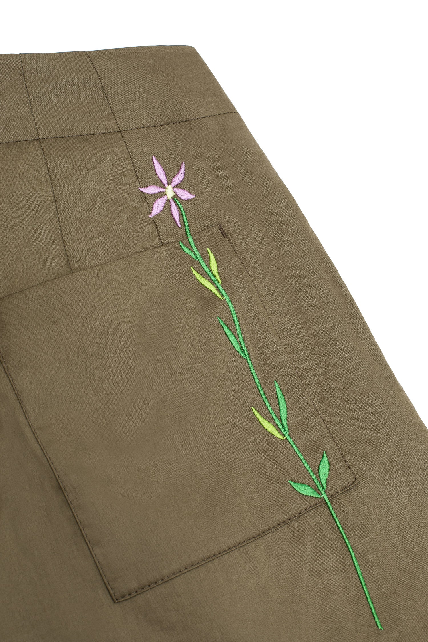 Womens wide leg culotte trouser in khaki cotton. Amelia Wide Leg Trouser by Saywood. Back close up of patch pocket and lilac embroidered flower
