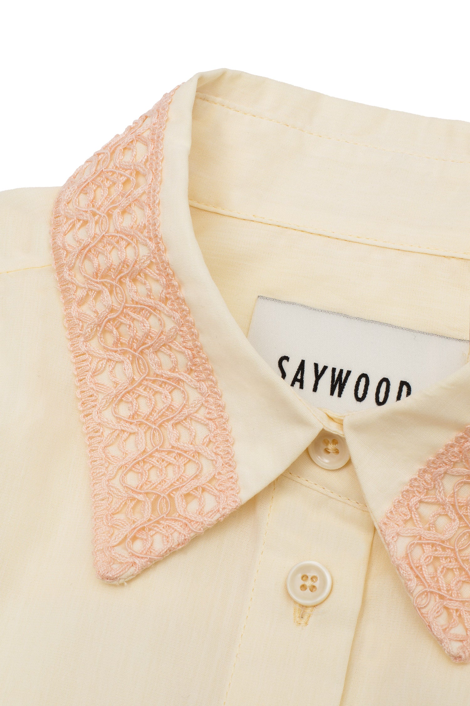 Womens pale yellow blouse with soft orange lace collar.