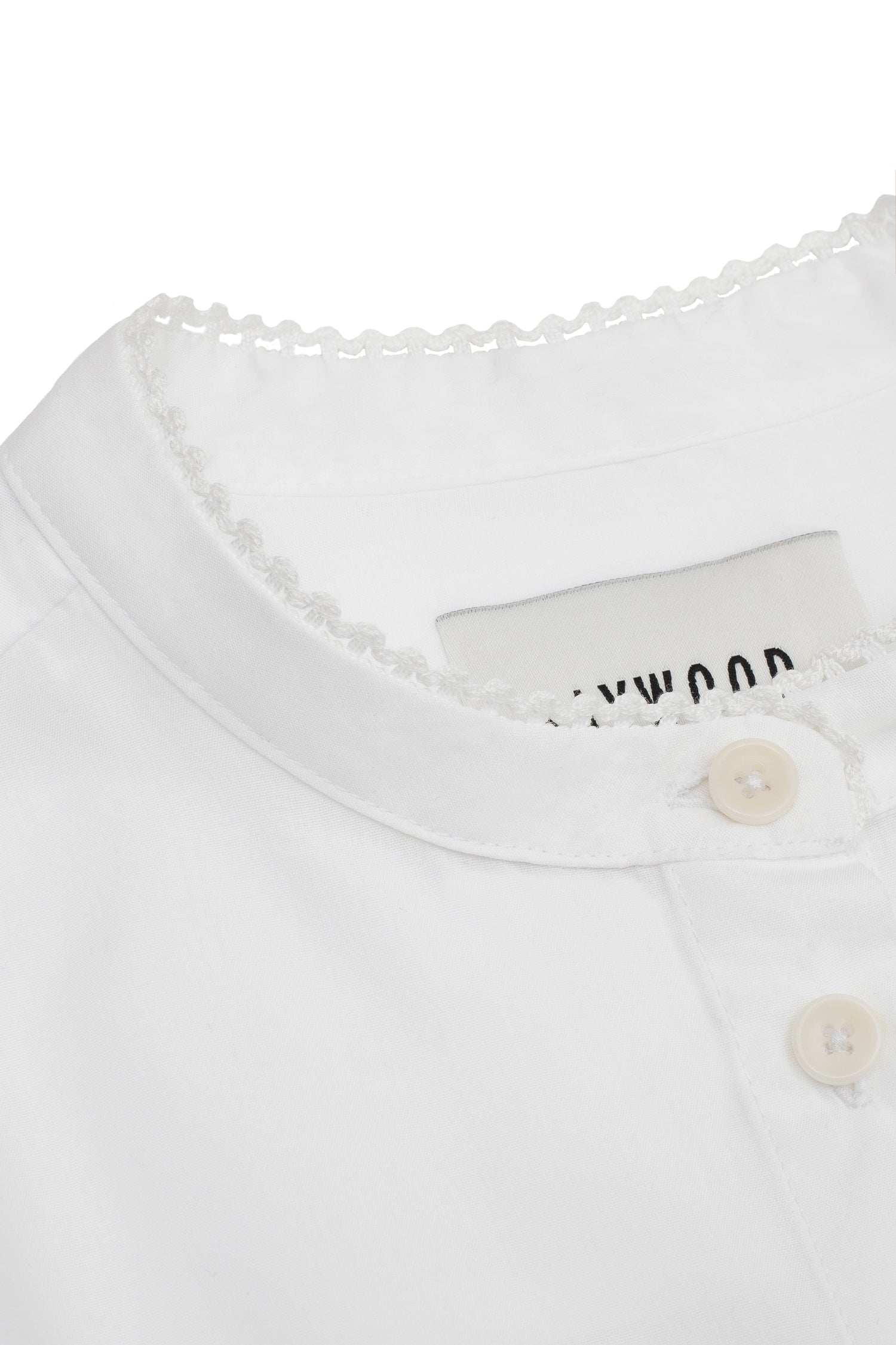 Womens white blouse with lace trim on grandad collar. Close up detail shot of Saywood's Joni Blouse.
