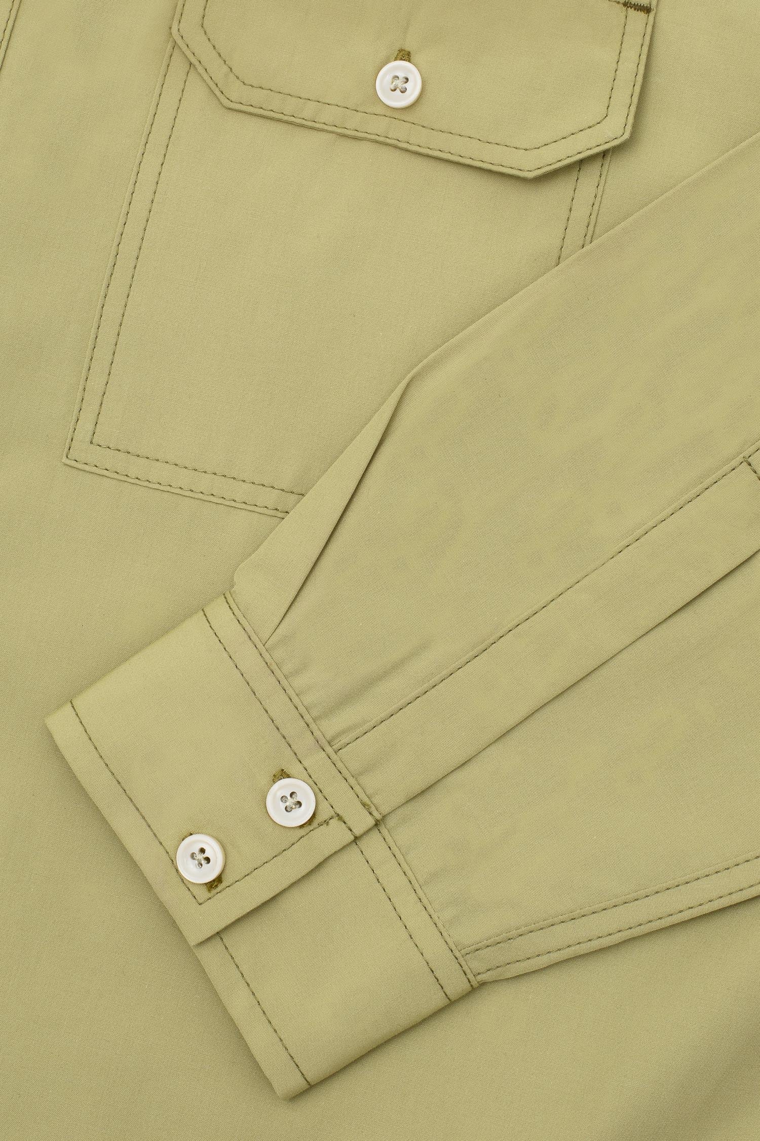 Mens Utility Shirt in olive khaki cotton. utility Patch Pocket details; the Eddy Shirt regular fit by Saywood. Close up of double button cuff and utility pocket.