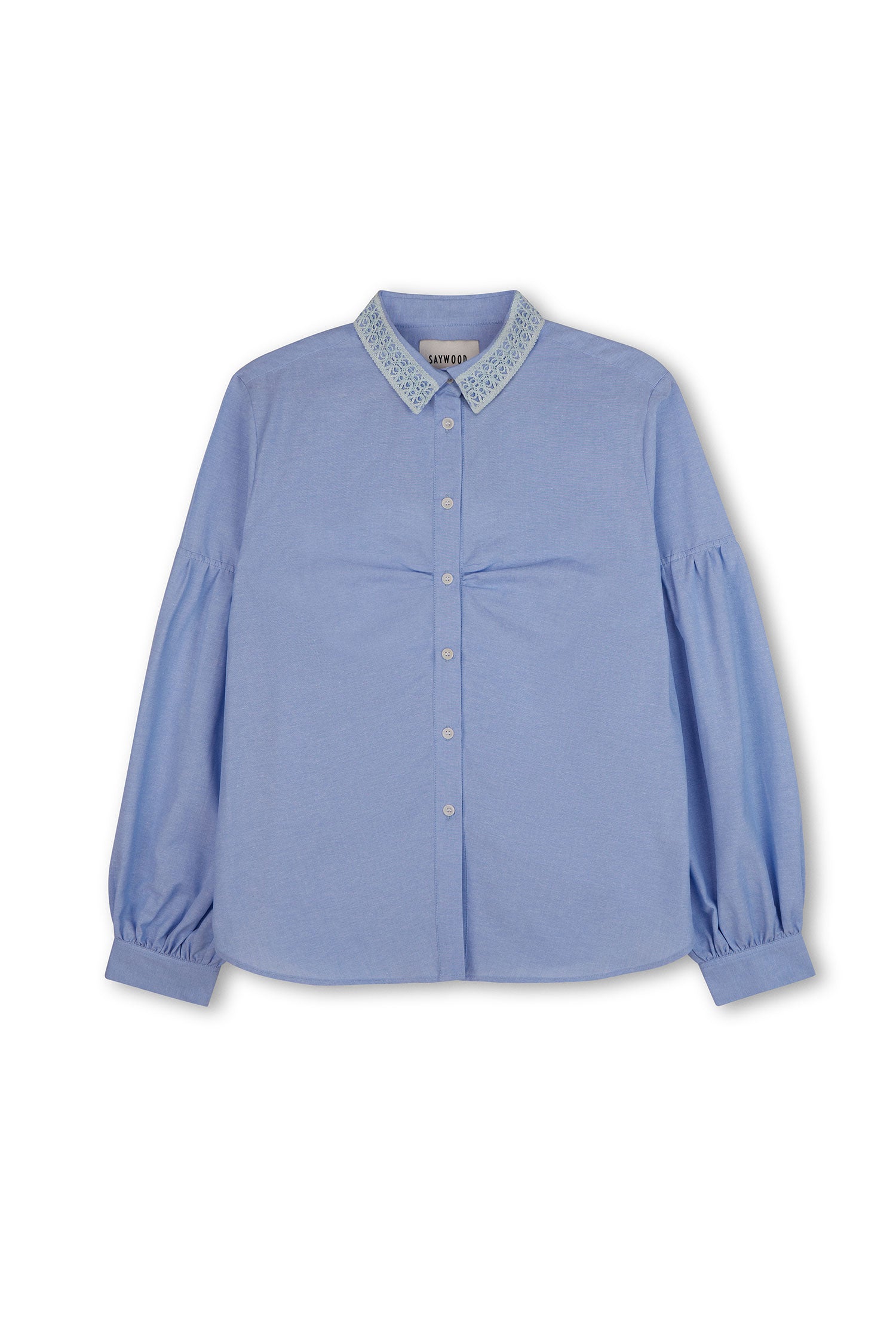 Womens pale blue shirt with lace trim collar and volume sleeves. Soft gathering is at the bust, with shirt made in recycled cotton. Shirt is on a white background