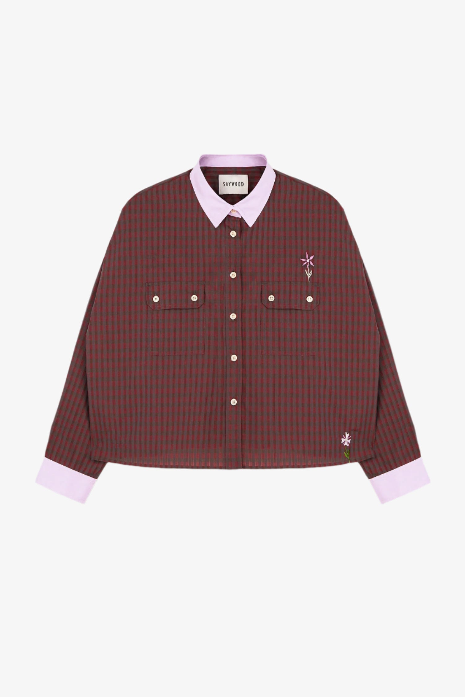 Womens mini red check shirt with a boxy silhouette. Jules Shirt from Saywood with embroidered flower detail, utility style pockets, and lilac contrasting collar and cuffs.