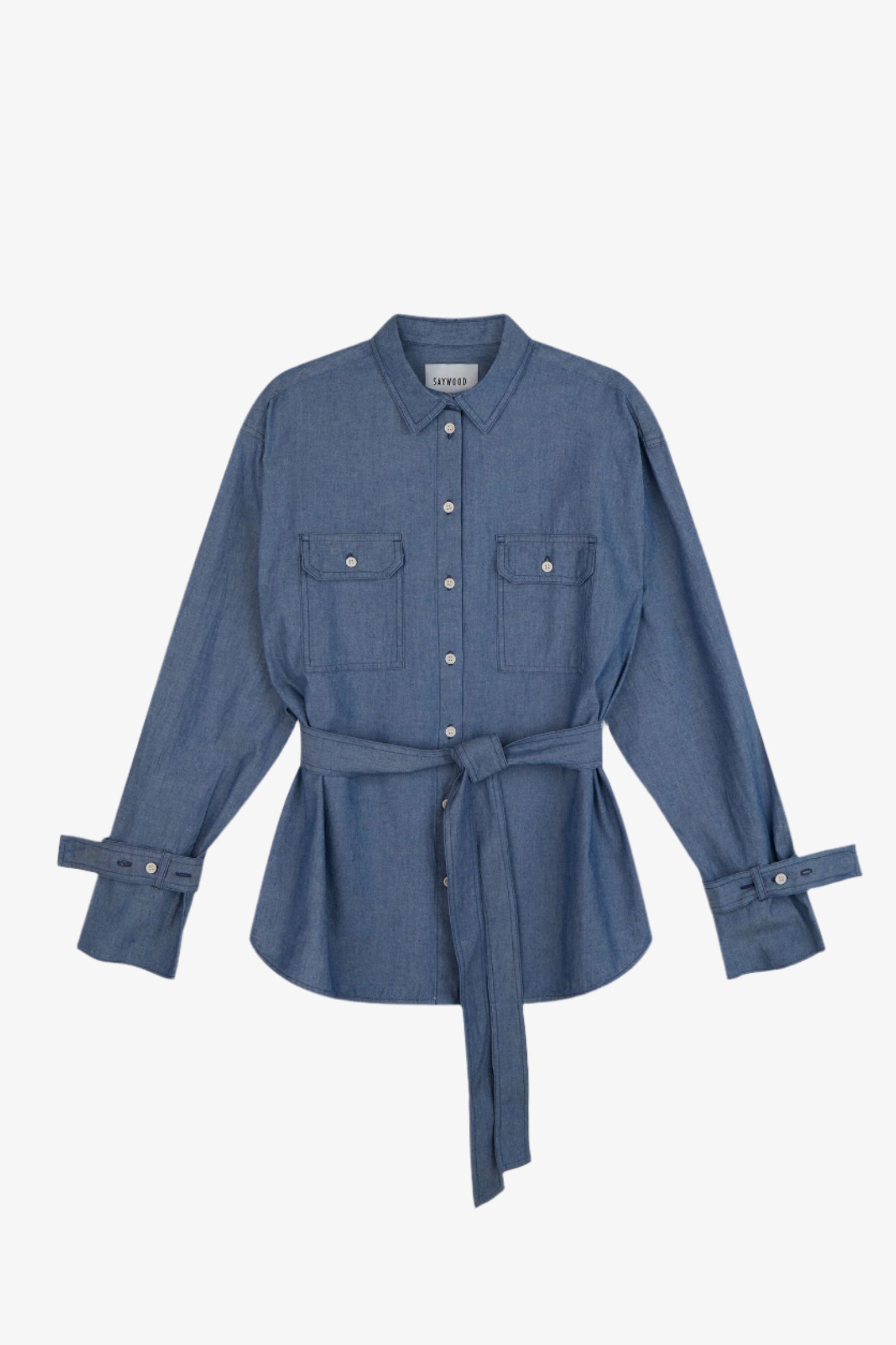 Womens Oversized Shirt Denim. Zadie Boyfriend Fit Shirt in Japanese Denim, light mid wash, with safari styling details, utility patch pockets, with a detachable tie belt and sleeve cuff details, by Saywood.