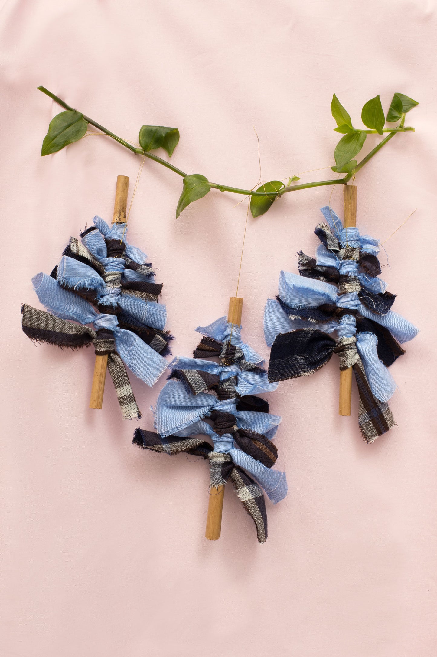 Christmas Tree decorations. Navy check and pale blue recycled cotton fabric Christmas tree with bamboo stem, handmade by Saywood. Sustainable Christmas Decoration.