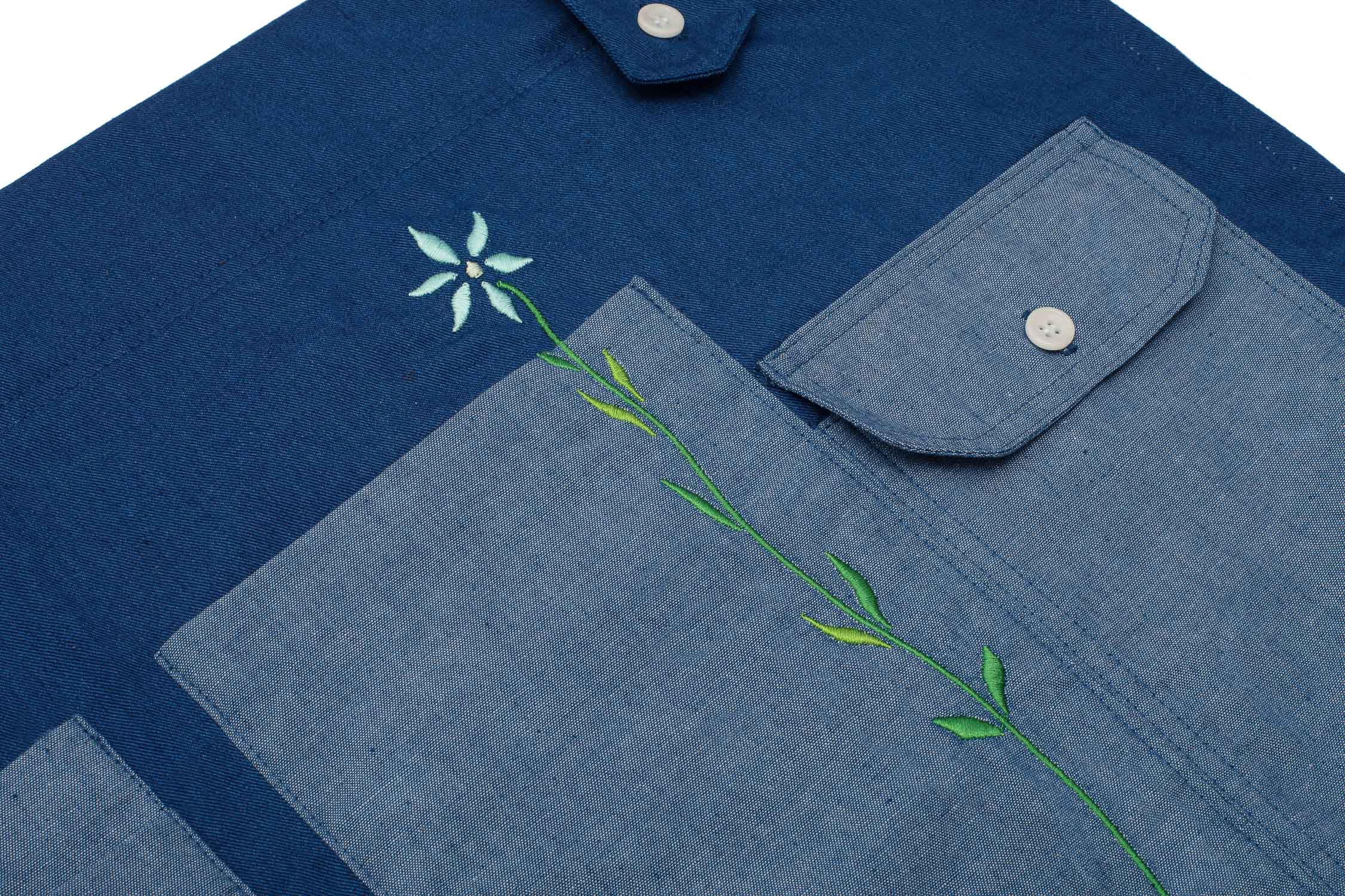 Gardening Apron. Tool Belt made in Japanese Denim, for the garden or multifunctional, by Saywood. Close up of pockets and embroidered flower.