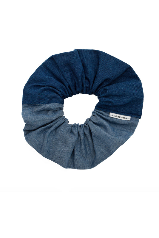 Patchwork scrunchie, made in mid wash and light wash Japanese denim. A Saywood label is stitched into the seam.