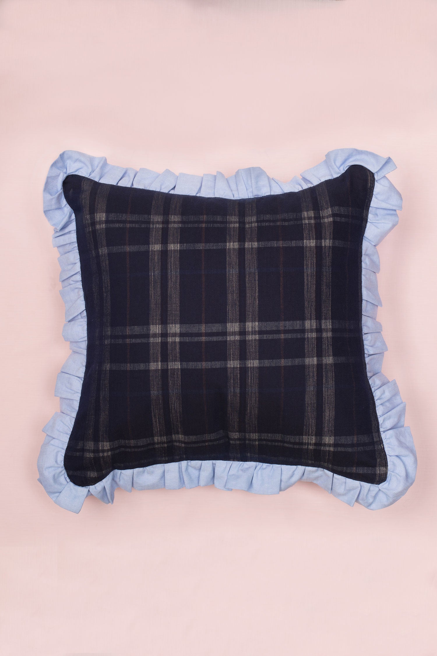 Navy check cushion with ruffle edge in pale blue, by Saywood